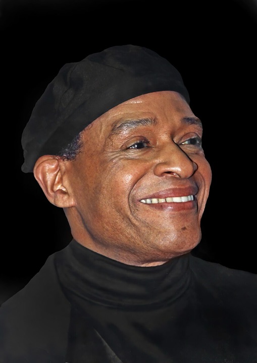Portrait of Al Jarreau wearing a black cap